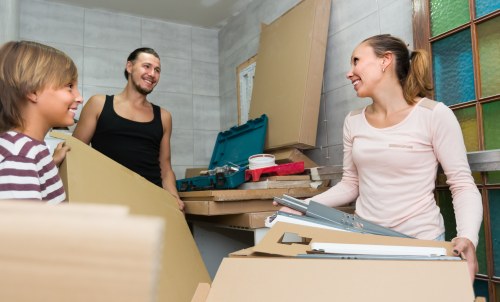 Man With Van Sutton team separating recyclable items during a move