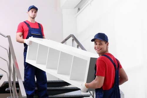 House removalists helping a Sutton family move belongings from a residential home