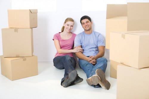 Unpacking household items into a new home in Sutton
