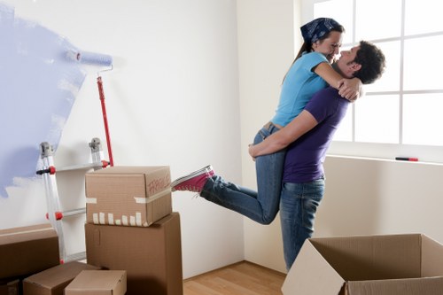 Office movers handling furniture and equipment in a Sutton workplace