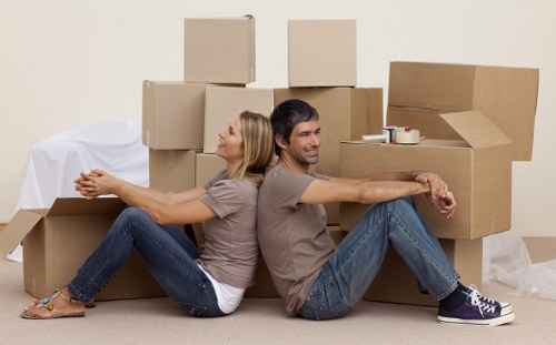 Professional movers loading furniture for removals in Sutton
