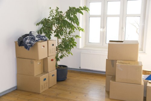 Packed moving boxes and household items prepared for a Sutton house move