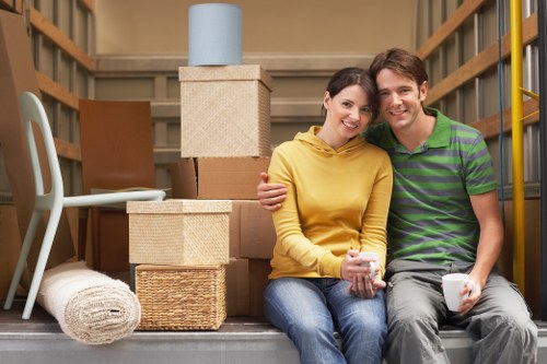 Professional packers handling fragile items during a Sutton removal