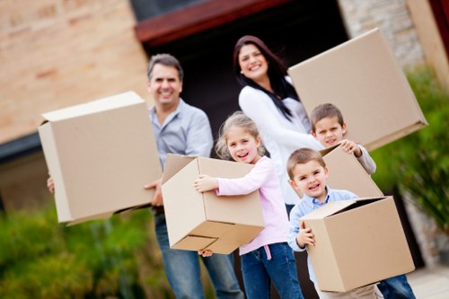Professional moving team loading furniture for a Sutton move