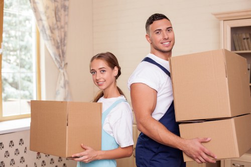 Packed office boxes and labelled items ready for relocation in Sutton
